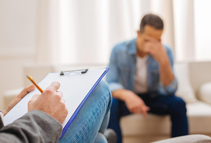 Man speaking with a specialist support in the community